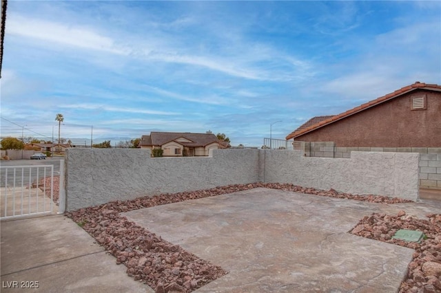 view of patio featuring a gate and a fenced backyard