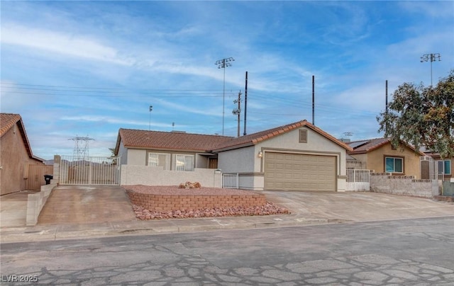 ranch-style home featuring concrete driveway, a tiled roof, an attached garage, fence, and stucco siding