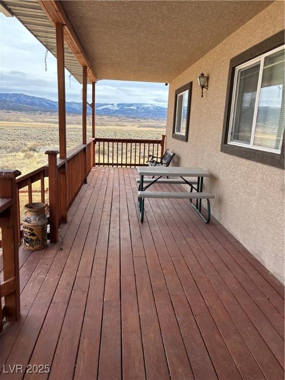 wooden terrace with a mountain view