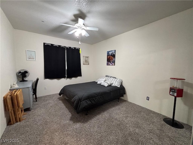 carpeted bedroom featuring a textured ceiling and a ceiling fan
