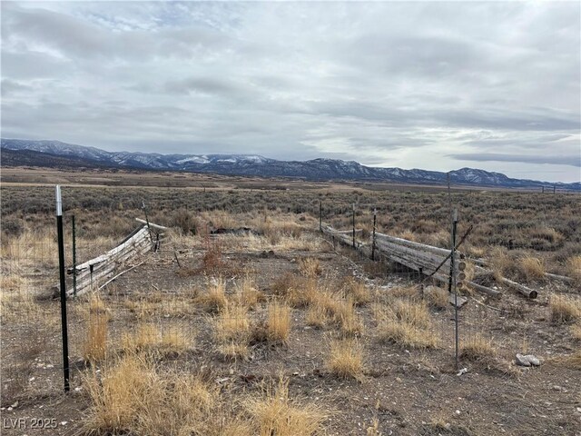 property view of mountains featuring a rural view