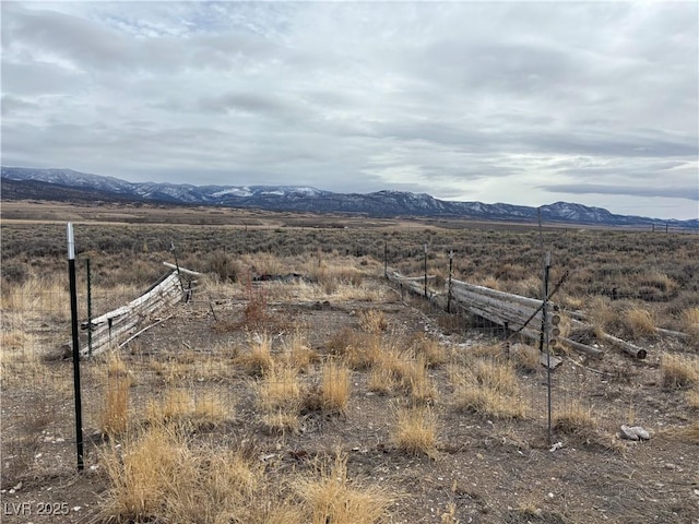 mountain view featuring a rural view