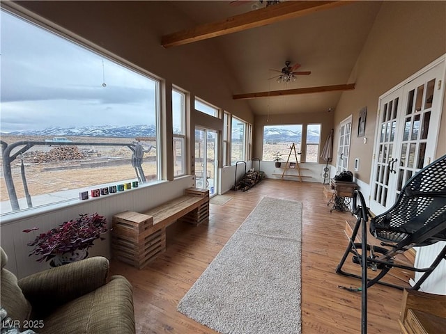 sunroom with french doors, vaulted ceiling with beams, and ceiling fan