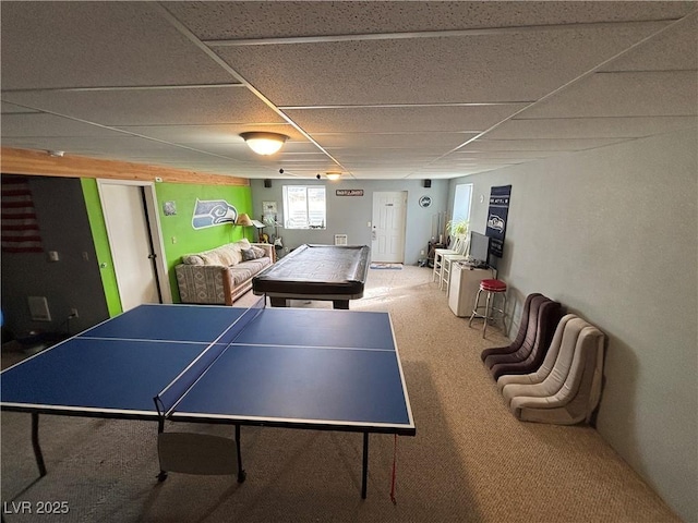 playroom featuring carpet flooring and a paneled ceiling