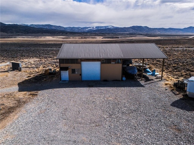 view of outbuilding with a mountain view and an outdoor structure