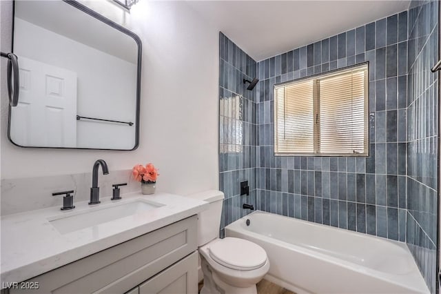 bathroom with shower / bath combination, toilet, and vanity