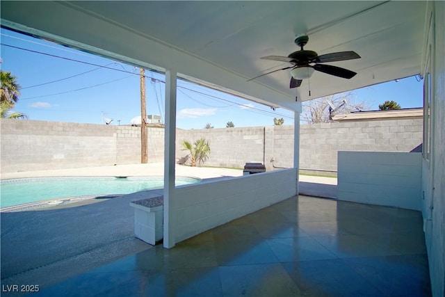 view of patio / terrace with a fenced backyard, a ceiling fan, and a fenced in pool