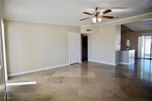 unfurnished room with ornamental molding, visible vents, a textured ceiling, and baseboards