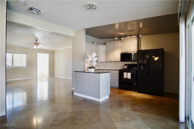 kitchen with tasteful backsplash, dark countertops, white cabinetry, and black appliances