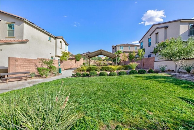 view of yard with fence and a residential view