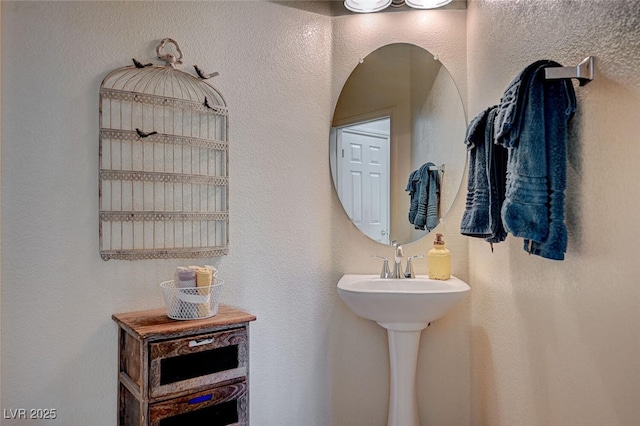 bathroom with a textured wall