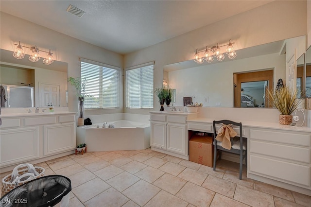 bathroom with a garden tub, visible vents, vanity, a shower stall, and tile patterned flooring