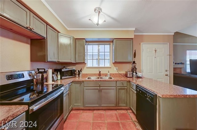 kitchen with plenty of natural light, appliances with stainless steel finishes, a peninsula, light countertops, and a sink