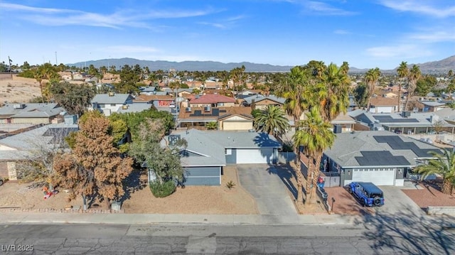 drone / aerial view featuring a mountain view and a residential view