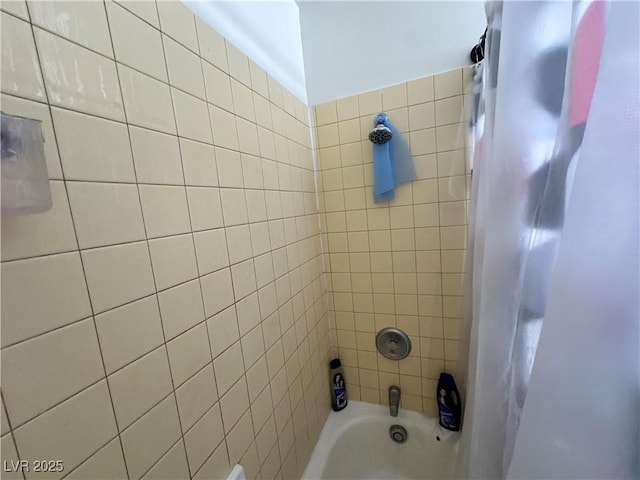 full bath featuring shower / tub combo with curtain