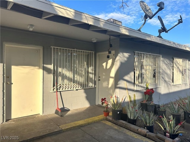 view of side of property with concrete block siding