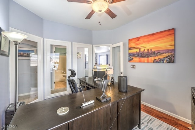 office with ceiling fan, baseboards, and wood finished floors