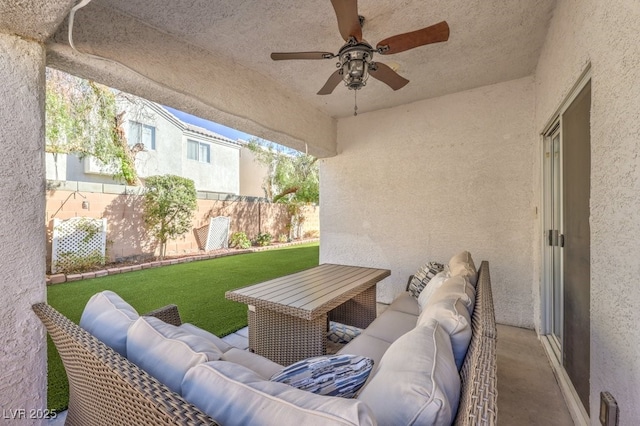 view of patio featuring a ceiling fan, fence, and an outdoor hangout area