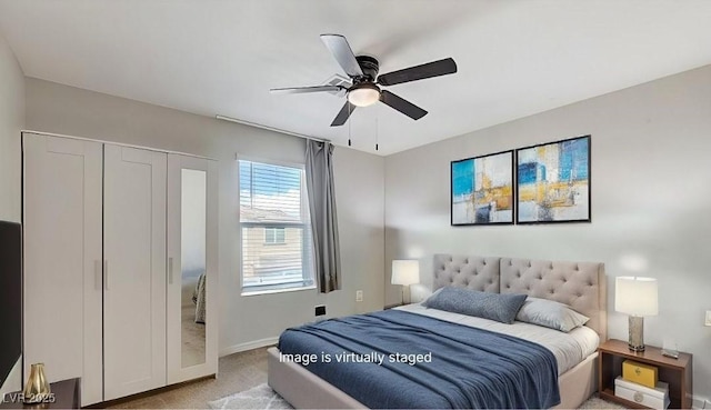 bedroom featuring light carpet, ceiling fan, and baseboards