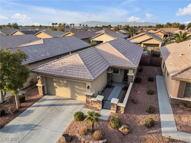 bird's eye view featuring a residential view and a mountain view