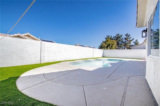 view of swimming pool with a fenced in pool and a fenced backyard