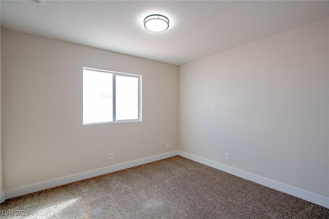 empty room with carpet flooring and baseboards