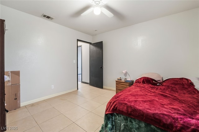 bedroom featuring visible vents, ceiling fan, baseboards, and light tile patterned floors