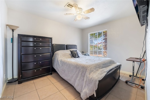 bedroom with light tile patterned floors, a ceiling fan, visible vents, and baseboards