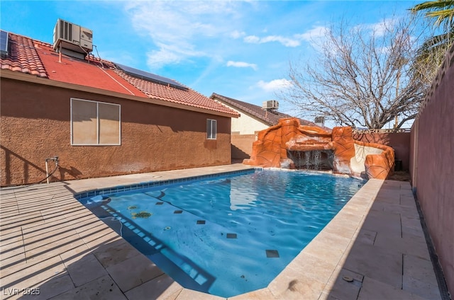 view of swimming pool featuring central air condition unit, a fenced backyard, and a fenced in pool