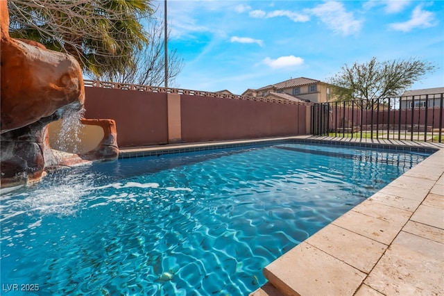 view of pool with fence