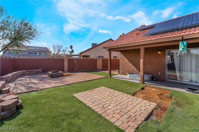 view of yard with a patio area, an outdoor fire pit, and a fenced backyard