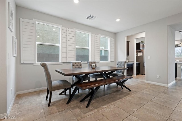 dining area with recessed lighting, visible vents, and baseboards