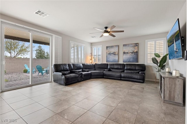 unfurnished living room featuring visible vents, ceiling fan, and tile patterned flooring