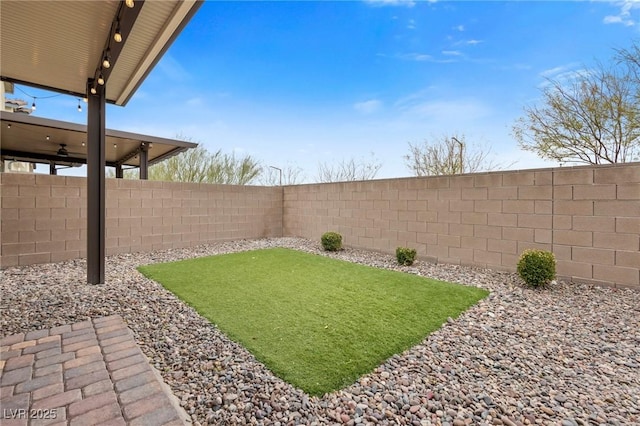 view of yard with a fenced backyard