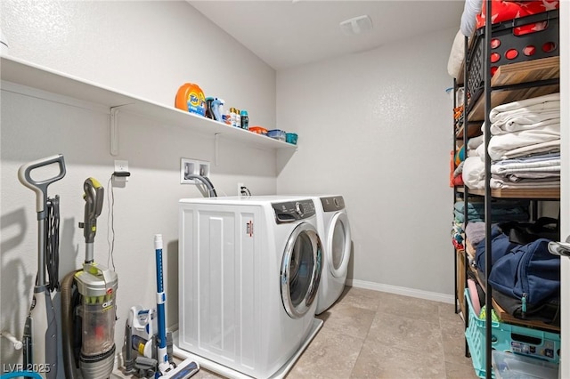 laundry area featuring visible vents, baseboards, laundry area, and washer and clothes dryer