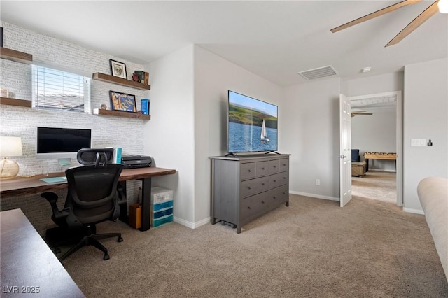 home office featuring carpet flooring, ceiling fan, baseboards, and visible vents