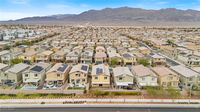 birds eye view of property featuring a mountain view and a residential view