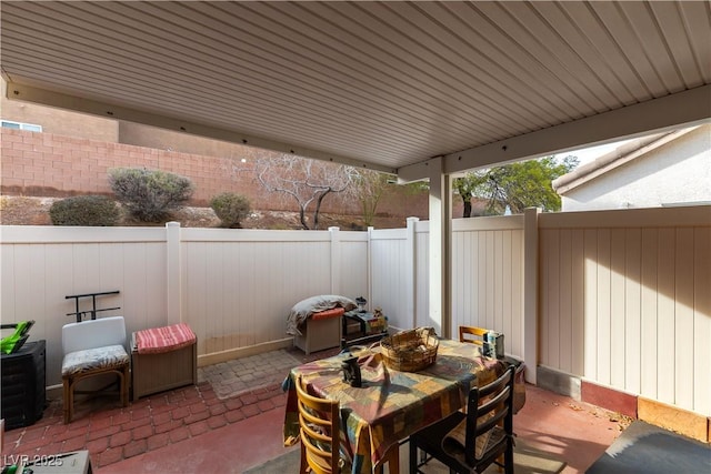 view of patio / terrace with outdoor dining area and a fenced backyard