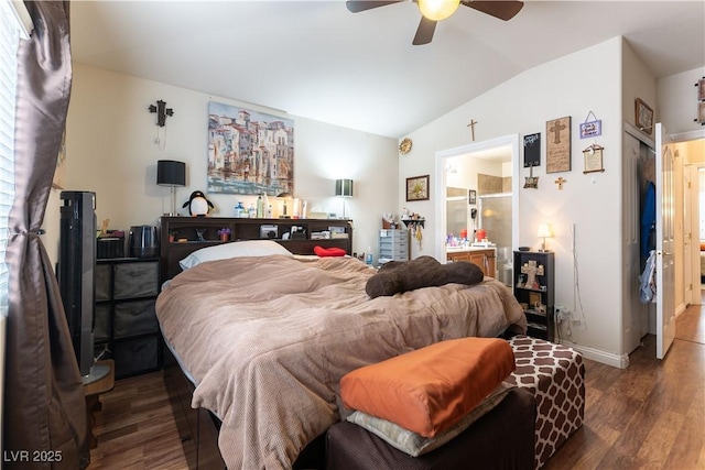 bedroom with vaulted ceiling, ensuite bathroom, wood finished floors, and baseboards