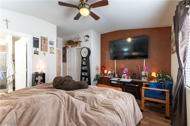 bedroom with vaulted ceiling, wood finished floors, and a ceiling fan