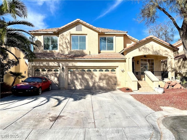 view of front of property featuring a garage, driveway, a tiled roof, and stucco siding