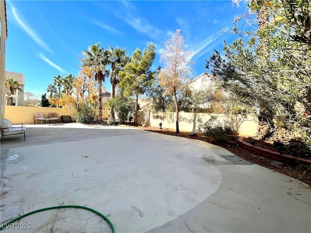 exterior space featuring a fenced backyard and a patio