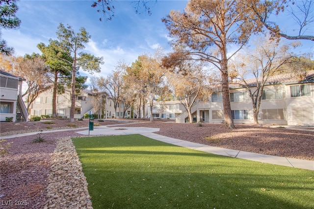 view of community with a residential view and a lawn