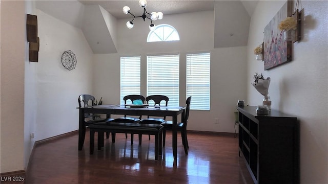 dining space with lofted ceiling, an inviting chandelier, baseboards, and dark wood-type flooring