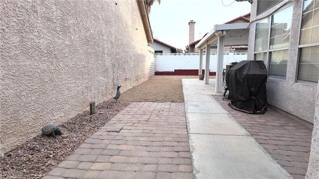 view of patio / terrace with area for grilling and a fenced backyard