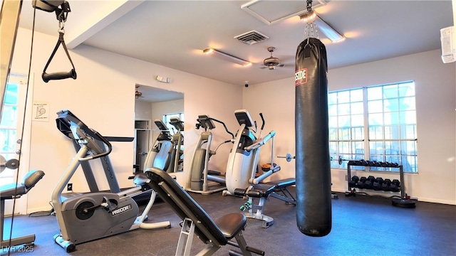 gym featuring baseboards and visible vents