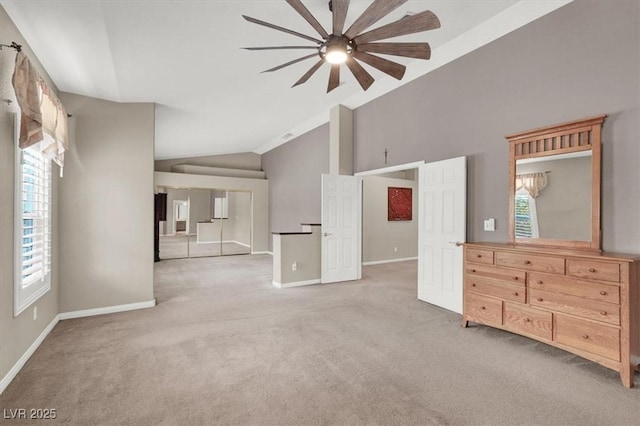 unfurnished living room featuring light carpet, baseboards, and a ceiling fan