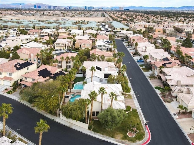 aerial view featuring a mountain view and a residential view