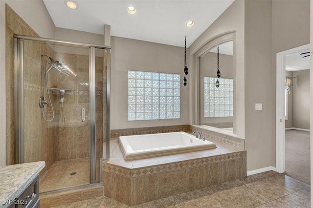 bathroom featuring a stall shower, tile patterned floors, a garden tub, vanity, and recessed lighting