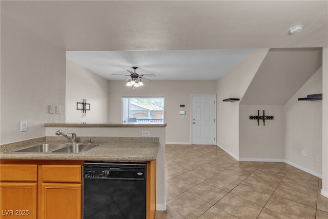 kitchen with light tile patterned floors, a sink, a ceiling fan, baseboards, and dishwasher